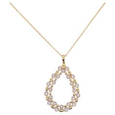 This pear shaped necklace is a gorgeous statement on any neck! The double pear is an open design that has 24 glorious diamonds that are bezel set and alternate with a lovely gold bead. The pendant is flat but 1 5/8 inches long. A drop diamond or gemstone could be added to the center of the pendant if you had a gemstone that you wanted to mount in a pendant. Such a graceful jewelry item! Material: 14K Gold Diamond Count: 24 Diamond Weight: .16 carats Diamond Clarity: VS-2 Diamond Color: G-H Measu Elegant Teardrop Rose Cut Diamond Necklaces, Elegant Teardrop Necklace With Rose Cut Diamonds, Fine Jewelry Teardrop Necklace With Rose Cut Diamonds, Yellow Gold Teardrop Necklace With Rose Cut Diamonds, Teardrop Diamond Necklace With Sparkling Stones, Rose Cut Diamond Teardrop Necklace, Teardrop Necklace With Rose Cut Diamonds, Teardrop Rose Cut Diamond Necklace, Gold Teardrop Pendant Necklace With Rose Cut Diamonds