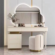 a white vanity table with a mirror and stool in front of it on the floor