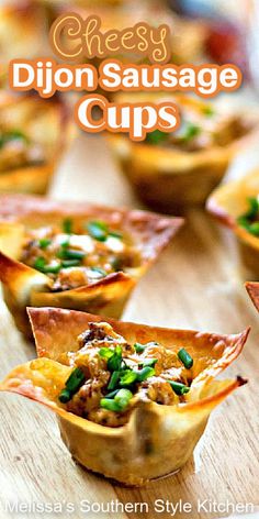 small cups filled with meat and vegetables on top of a wooden table in front of the words cheesy dijon sausage cups