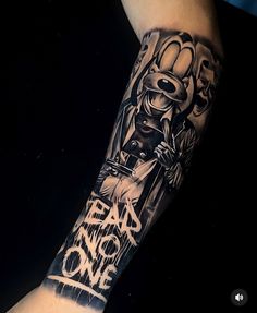 a man's arm with a cartoon character on it and the words, don't