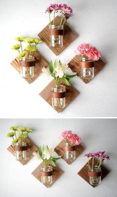 three vases with flowers in them are hanging on the wall and one is made out of wood