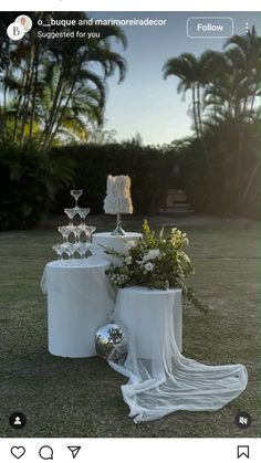 an image of a table set up with cake and flowers on it for a wedding