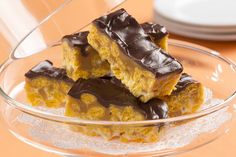 three pieces of cake sitting on top of a glass plate