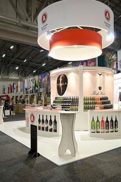 an exhibition stand with many bottles on display