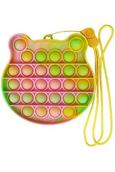 a handbag with circles on it and a yellow lanyard hanging from the strap