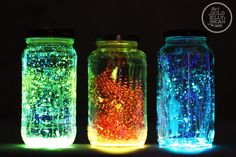 three mason jars filled with different colored lights