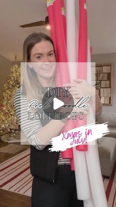 a woman is holding two giant pink and white poles in her hands, with the words diy fabric columns on it