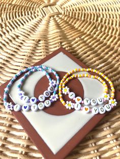 "Mommy and me matching bracelet sets for back to school. listing is for one set, please let us know which color scheme you would like!  Adult bracelet is 7\", and kids bracelet is 5\", perfect for pre-k- kindergarten. Let us know in the personalization box if you need a specific size. Available in 2 color options; sunrise (yellow and orange) and mermaid (purple and teal).  *CONNECT WITH US * Instagram - @humblehands_co For wholesale inquiries, message us or email us at info@humblehandsco.com * R Back To School Bracelets, Mother Daughter Bracelet Set, Mermaid Purple, Team Bracelets, Daughter Bracelet, Toddler Bracelet, Kids Bracelet, Mother Daughter Bracelets, Family Bracelets