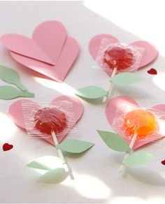 valentine's day candy lollipops with paper hearts and leaves on them