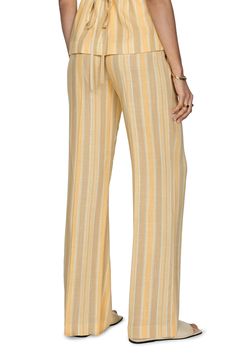 Variegated stripes and buttery hues animate these summery pants cut from a linen-kissed fabric. Zip fly with button closure Cotton lining 85% viscose, 15% linen Dry clean or machine wash, line dry Imported Chic Striped Wide Leg Pants For Beach, Summer Linen Striped Bottoms, Striped Linen Pants With Elastic Waistband, Striped Linen Summer Bottoms, Spring Striped Linen Pants, Striped Linen Bottoms For Summer, Chic Striped Linen Bottoms, Striped Linen Pants For Spring, Striped Wide-leg Linen Pants