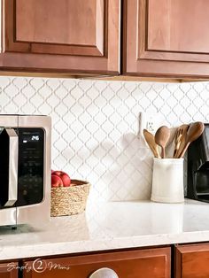 the kitchen counter is clean and ready to be used as a coffee maker, toaster oven, utensil holder, etc