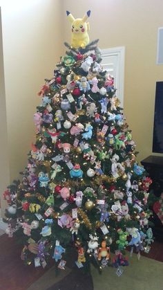 a pokemon christmas tree with stuffed animals on it