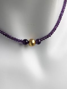 Experience the captivating allure of the Amethyst Glow Necklace. Handcrafted with exquisite attention to detail, this elegant piece features stunning amethyst gemstones complemented by hand-gilded 23 karat gold leaf on lava stone beads With its 17-inch length and 14 karat gold-filled toggle clasp, this necklace exudes timeless sophistication and adds a touch of enchantment to any outfit. Embrace the magic of the Amethyst Glow Necklace and radiate elegance wherever you go. Amethyst is a fascinati Glow Necklace, Glow Jewelry, Glowing Necklace, Semi Precious Gems, Lava Stone, Purple Hues, Precious Gems, Toggle Clasp, Amethyst Gemstone