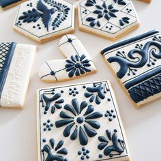 blue and white decorated cookies on a table