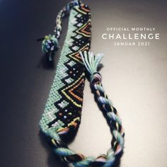 a close up of a bracelet on a table with the words official month challenge written below it