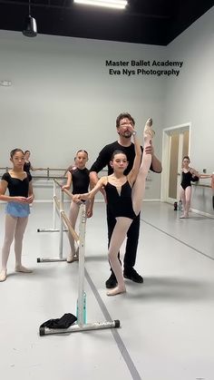 a group of people standing around each other in front of a ballerina's