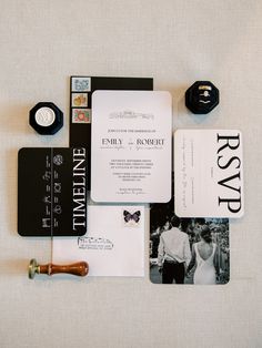 the wedding stationery is laid out neatly