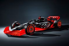 a red and black race car on a dark background