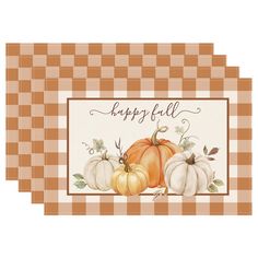 two place mats with pumpkins on them and the words happy fall written in cursive writing