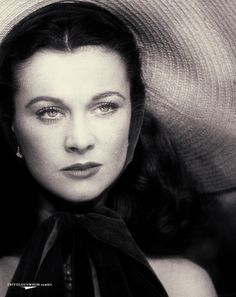 black and white photograph of a woman wearing a hat