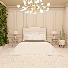 a white bed sitting next to a green plant on top of a wooden floor in a bedroom