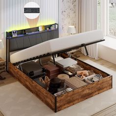 a bed with drawers underneath it in a room