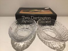 two glasses sitting on top of a table next to a box with the label two darrington