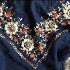 Navy Blue Scarf With Floral Embroidery In Great Shape. Never Worn. Measurements: Coming Soon Excellent Condition Great Christmas Present Festive Blue Embroidered Fabric With Floral Embroidery, Festive Blue Embroidered Fabric With Floral Details, Festive Blue Embroidered Fabric, Festive Blue Floral Embroidered Fabric, Blue Bohemian Embroidered Fabric For Festive Season, Blue Cotton Fabric With Floral Embroidery, Navy Blue Scarf, Blue Scarf, Flower Embroidery