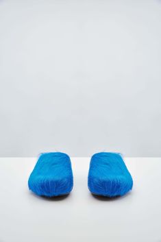 For Pre-Fall 2024, Marni refreshed its iconic calf hair slippers with a striking blue hue, making them the perfect statement shoe of the season. Cargo Coat, Candle Reading, Charlotte Chesnais, Craig Green, Scarf Shirt, Statement Shoe, Shirts For Leggings, Cape Coat, Jeans Jumpsuit