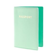 a passport case with the word passport written on it in gold foil and green leather