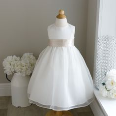 This Ivory Flower Girl Dress In Size 2t Is Breath Taking! The Sleeveless Dress Has A Luxurious Matte Satin Bodice (As In Bridal Gowns, Not Like Shiny Satin Sheets) That Zips In Back. The Flared Gathered Skirt Has An Ivory Organza Overlay. The Skirt Has Another Liner That Has A Large Crinoline Ruffle For Volume And Flare. The Luxurious Satin Sash Comes In A Champagne Hue And Is Done In A Cummerbund Style In The Front. The Back Ties Into A Long Flowing Bow For A Perfect Fit. Upper Zippered Back. G 2t Flower Girl Dress, Ivory Flower Girl Dress, Organza Overlay, Satin Flower Girl Dress, Satin Sheets, Ivory Flower, Hair Wreath