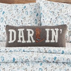 a pillow with the word darn written on it