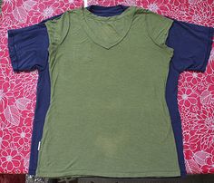 two t - shirts laying next to each other on a pink flowered cloth background