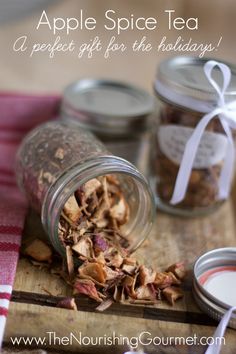 an apple spiced gift for the holidays in a glass jar with cinnamons and apples