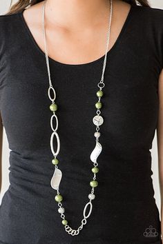 Over sized green pearls, ornate silver beads, and an array of glistening silver accents trickle along a lengthened silver chain for a refined look. Features an adjustable clasp closure.  Sold as one individual necklace. Includes one pair of matching earrings. Green Metal Jewelry With Silver Beads, Silver Pearl Jewelry With Dangling Beads, Silver Pearl Beaded Necklace With Dangling Beads, Elegant Green Necklaces With Dangling Beads, Elegant Green Necklace With Dangling Beads, Green Silver Beaded Jewelry For Party, Elegant Green Jewelry With Silver Beads, Elegant Green Beaded Necklaces With Dangling Beads, Elegant Silver Beaded Necklace With Dangling Beads