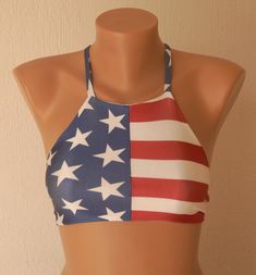 American flag bikini top I created this stylish and unique American Flag strappy high neck halter bikini top from soft, flexible and durable spandex blend material. This trendy American Flag bikini top is perfect beach bra swimsuit top at the beach or the pool.This padded flag crop top is double layered throughout. You can choose size during the purchasing.Also this American Flag halter black bikini top can be worn high waisted shorts and denims to go to festival or to club. SIZE CHART; (XS) Ext American Flag Crop Top, Patriotic Swimwear, Beautiful Swimwear, High Neck Swimwear, Stage Coach, Faster Horses, High Neck Halter, Yoga Top, Country Concert