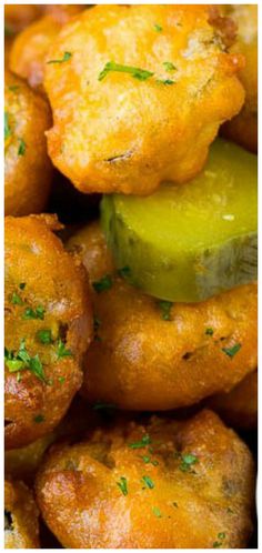 closeup of fried food with cucumber and parsley on the top side