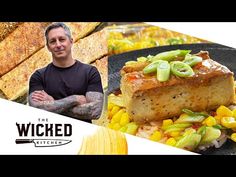 a man standing in front of a plate of food with corn on the cob