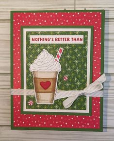 a close up of a greeting card with a cup of coffee and candy canes