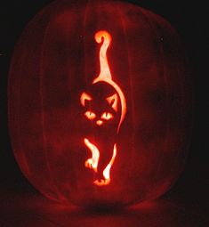 a carved pumpkin with a cat on it