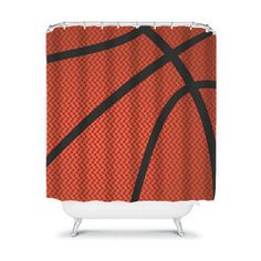 an orange and black shower curtain with a basketball pattern on the bottom, in front of a white background