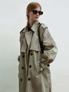 Editor's notesWhether the elements with this double-breasted trench featuring our iconic turn-lock hardware for a heritage touch. Crafted in a sturdy poly blend, the transitional, belted silhouette is finished belting at the sleeves.- Oversized collar- Front and back panel- Double-breasted button closure- Deep back vent- Maxi long trench coat- Angled side pocketsMeasurements(in.)- Size: One size(XS-M)- Chest: 23.62in- Sleeve: 27.56in- Length: 45.28in- Model Info: 5' 7 / BUst 32.28in / Waist 23.6 Classic Khaki Outerwear With Double-breasted Button, Classic Khaki Double-breasted Outerwear, Classic Spring Outerwear With Belt Loops, Classic Khaki Outerwear With Belted Cuffs, Classic Khaki Belted Outerwear, Khaki Belted Double-breasted Outerwear, Khaki Belted Gabardine Outerwear, Khaki Gabardine Belted Outerwear, Classic Double-breasted Outerwear With Belt Loops