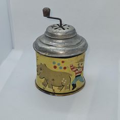 an old tin can with a horse on it