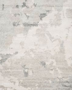 an area rug with grey and white colors