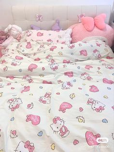 a bed with hello kitty sheets and pillows