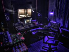 a recording studio with sound equipment and lights