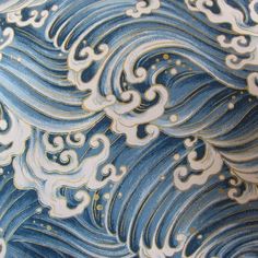 an artistic blue and white pattern with waves