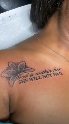 a woman with a tattoo on her chest saying god is within her she will not fail