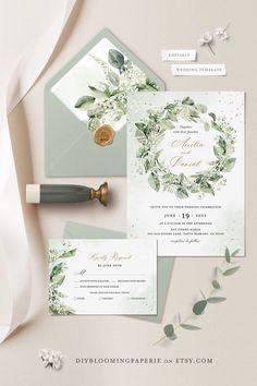 wedding stationery with greenery and calligraphy on the front, in green tones