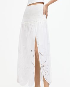 Bohemian styling meets broderie. The Alex Skirt is crafted from cotton to a midi length silhouette. It's shirred with elastic at the waist and hips for an easy fit with delicate gathered detailing and a side split. The hem has relaxed but full shape that is decorated with scalloped and embroidered broderie detailing. Try it on - sun soaked days are calling.  This skirt is designed to a relaxed fit Concealed zip closure Midi length High rise Shirred top panel Gathered trim edge Side split Scallop Spring Knitwear, Shirred Top, Womens Maxi Skirts, Embroidered Skirt, Wedding Guest Dress Summer, Black Wrap Dress, Cotton Skirt, Side Split, Date Night Outfit